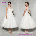 Vintage Style Tea-Length Wedding Dress with Lace Embellished Illusion Neckline Gives This Classic A-Line a Modern Update